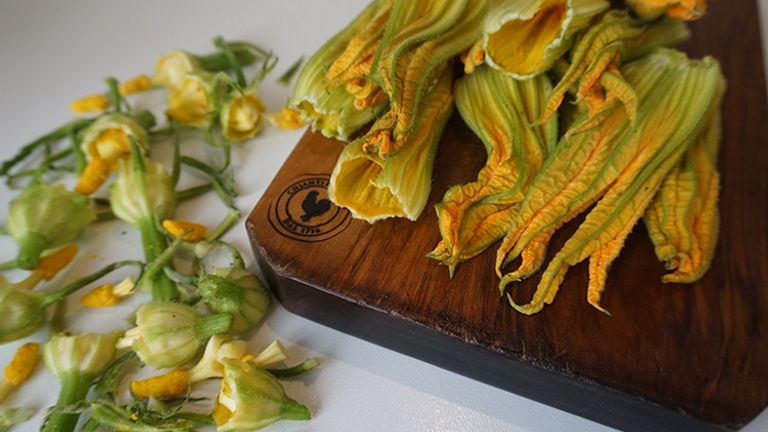 Squash blossoms are prepped before being deep-fried. // © 2017 Valerie Chen