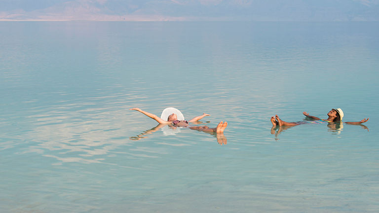 The lake's high salinity enables people to float easily. // © 2015 iStock