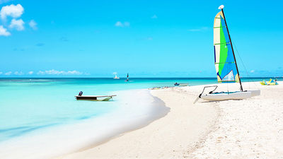 Naturists and clothing-optional travelers can get onboard Bare Necessities’ “Big Nude Boat” cruise, which has a stop in Aruba. // © 2017 iStock