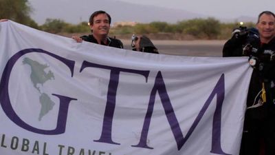 Skydivers at Tucson, Arizona’s Pima Air & Space Museum welcome attendees of GTM West, the inaugural event by TravelAge West and Travel Weekly. // © 2014 Eugene Ko