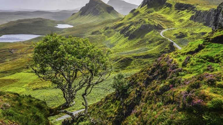 Hiking through the loch-filled Quiraing mountains is a popular activity on the Isle of Skye. // 2014 MartinM303/ Thinkstock 