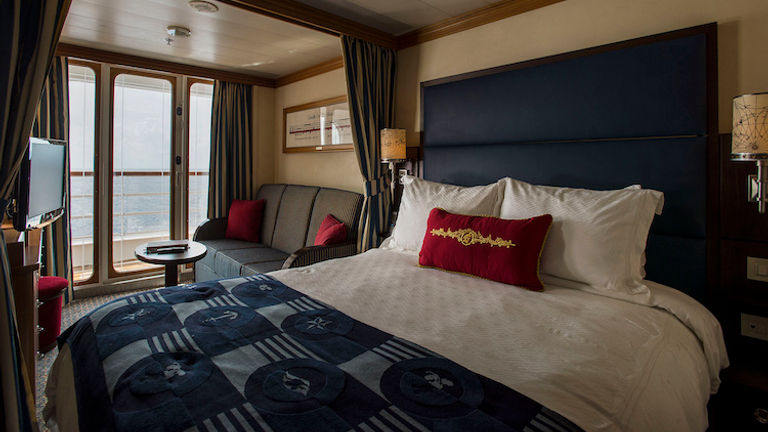 Staterooms feature nautical decor and split bathrooms. // © 2016 Disney Cruise Line