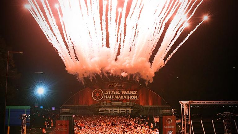 Jason Ryf, age 45, from Oshkosh, Wis., crosses the finish line first to win the inaugural Star Wars Half Marathon. // © 2017 Walt Disney World