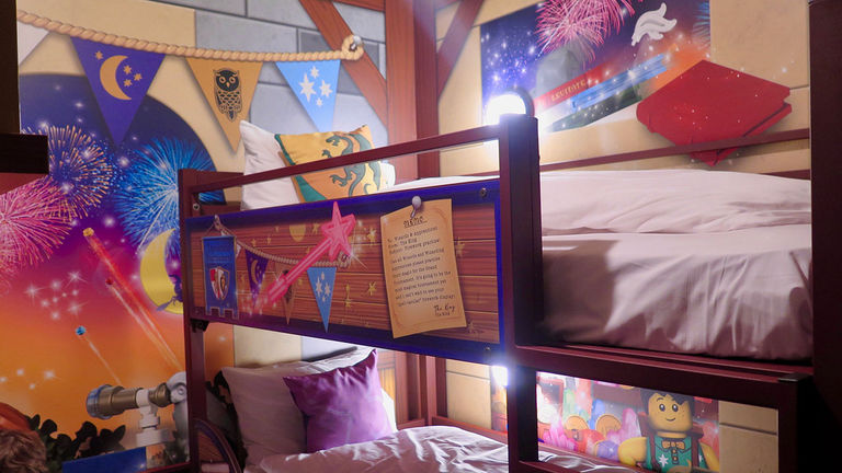 The kids’ area features bunk beds and a Lego play space.