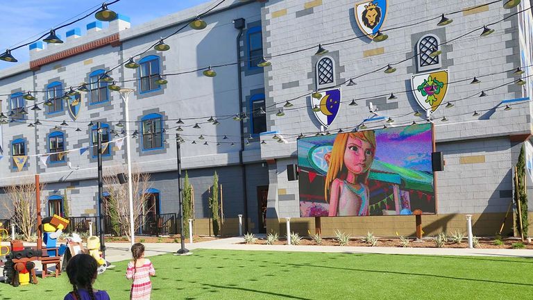 An outdoor cinema shows Lego movies.