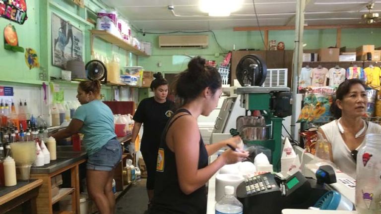 Located in the quaint town of Haleiwa, the famous Matsumoto Shave Ice serves up cool, colorful treats flavored with homemade syrups — and it’s worth the wait. // © 2014 Chelsee Lowe