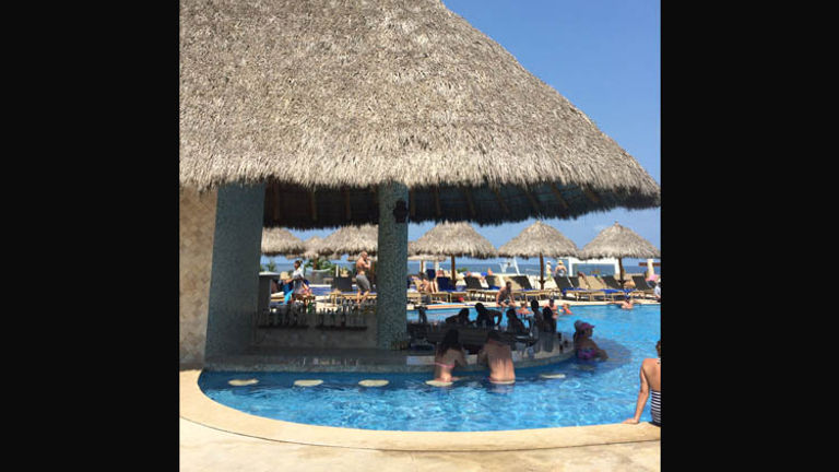 When parents staying at Iberostar Playa Mita can escape for a moment, they should swim up to this beautiful bar at the main pool. // © 2015 Chelsee Lowe