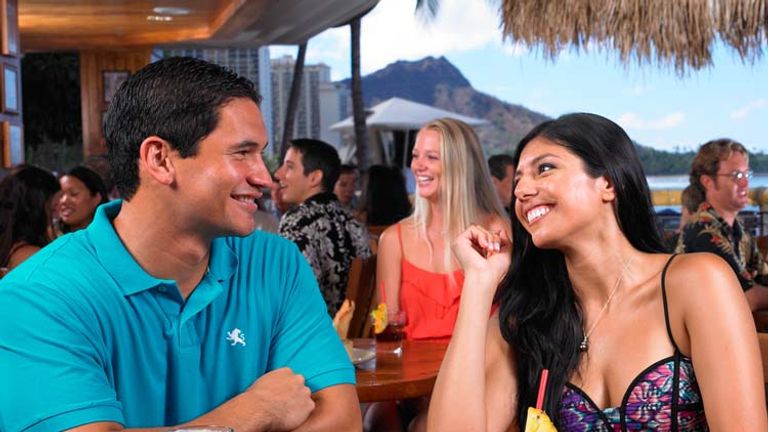 Among the most iconic bars in Waikiki is the Barefoot Bar at Duke's Waikiki in Outrigger Waikiki on the Beach. // © 2013 Duke's Waikiki