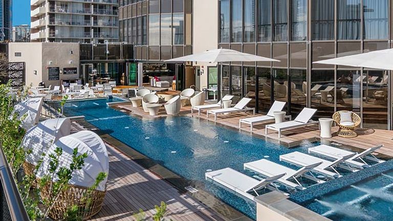 The property’s deck features a wading pool and plenty of seating as well as tables for alfresco dining. // © 2017 Hyatt Centric Waikiki Beach