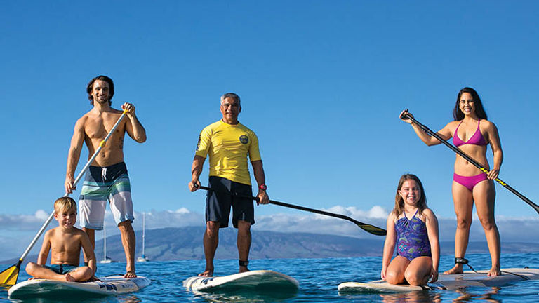 Paddleboarding lessons are available via the KBH’s water activities center, Hale Huakai. // © 2018 Kaanapali Beach Hotel