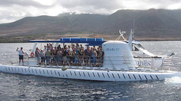 Atlantis Submarines’ patrons departing from Lahaina Harbor can book packages that include a submarine adventure and an ocean-front luau. // © 2014 Atlantis Submarines