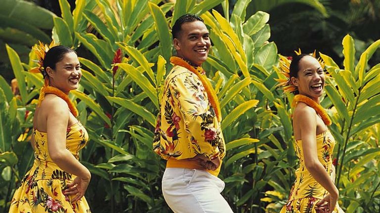 Hula dancers greet guests at Polynesian Cultural Center's Alii Luau, one of Hawaii’s great luaus. // © 2013 Polynesian Cultural Center