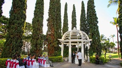 After a tropical garden wedding under Fairmont Kea Lani’s gazebo, the bride and groom walk to the nearby beach for sunset photos. // © 2014 Fairmont Kea Lani, Maui