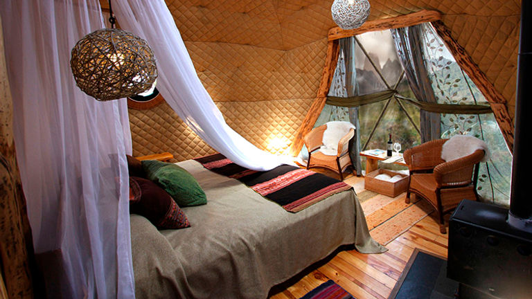A Suite Dome at EcoCamp Patagonia in Chile has comforting amenities such as a private bathroom and a heater, but is still eco-friendly with beautiful wildlife just outside.// © 2015 EcoCamp Patagonia
