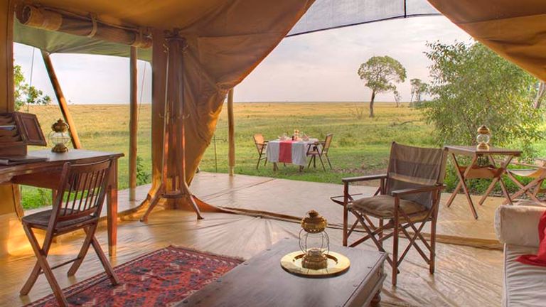 Spot wandering wildlife when you kick back in your Honeymoon/Family Suite tent at Elephant Pepper Camp, located in Masai Mara, Kenya. // © 2015 Elephant Pepper Camp, Kenya