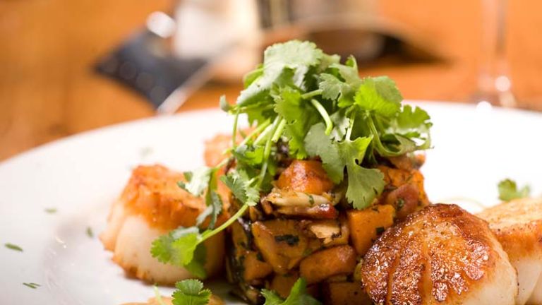 At the ski-in, ski-out Stonebridge Inn in Snowmass, native Colorado chef Randal Baldwin creates seasonal menu and handpicks wine at The Artisan Restaurant & Bar. // © 2014 Destination Hotels and Resor