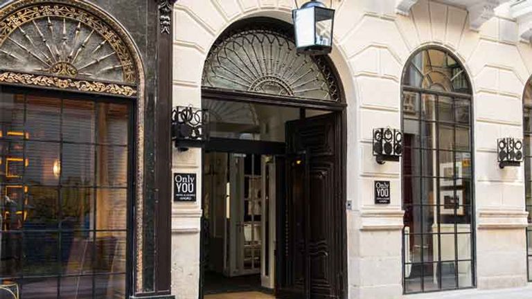 The original facade and  sign of the bookstore were preserved during the building’s remodel.  // © 2014 Only You Hotel & Lounge Madrid
