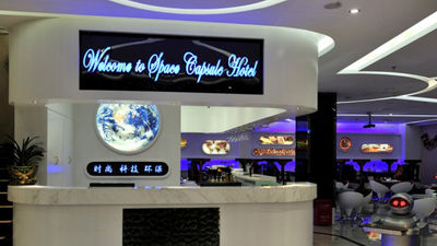 As one of the world’s most tech-savvy hotels, Pengheng Space Capsules Hotel in Shenzhen, China offers guests space-like rooms and a robotic staff. // © 2014 Pengheng Space Capsules Hotel