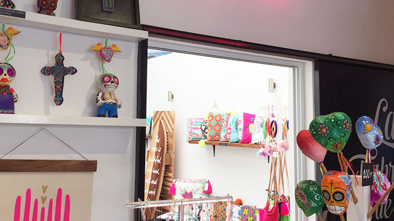 Cheeky throw pillows and T-shirts are only some of the amusing goods sold at Revolucion del Sueno boutique. // © 2015 Valerie Chen