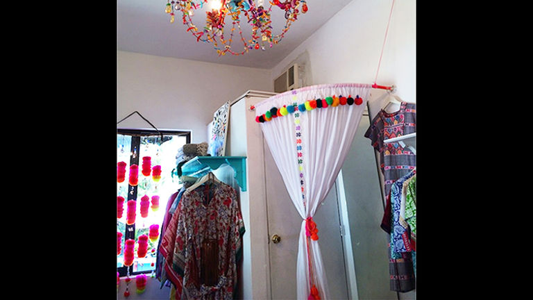 Ula is a shop decorated in poms and color, featuring scarves, handbags, bikinis and more. // © 2015 GypsetGirl.com