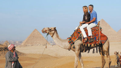 One draw of river cruising to an exotic destination is the choice of land excursions, such as riding camels in Egypt. // © 2015 Uniworld Boutique River Cruise Collection