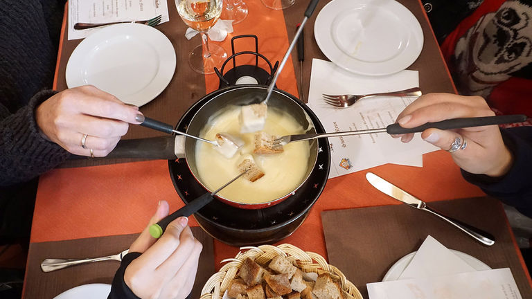 Try a traditional fondue lunch at a local Swiss restaurant in Lucerne.