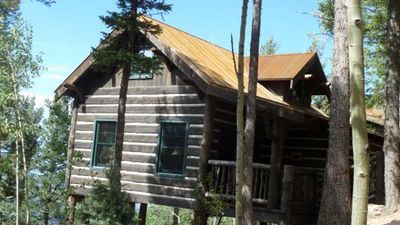Cloud Camp at the Broadmoor resort in Colorado Springs was constructed with the least possible disruption to the landscape — the cabins fit between trees and boulders. // © 2014 Claire Walter