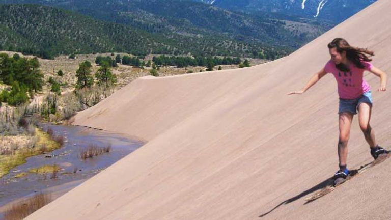 Adventure seekers can try sandboarding in the park. // © 2014 Great Sand Dunes National Park & Preserve