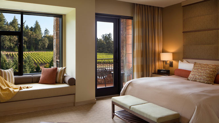 Guestroom amenities include a fireplace, a bay window and a balcony. // © 2017 The Allison Inn & Spa