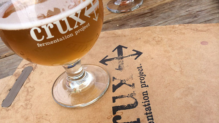 At Crux, the fermentation and brewing process surrounds the tasting room, creating an intimate beer-drinking experience. // © 2018 Creative Commons user adambarhan