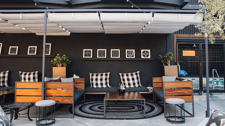 A patio area offers guests the chance to work outside, unwind with a cocktail from on-site restaurant Tart or relax after a dip in the pool.