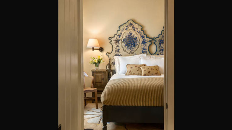 Because the original property featured twin beds, new king-size headboards were created by combining two headboards. // © 2014 Ryan Heffernan