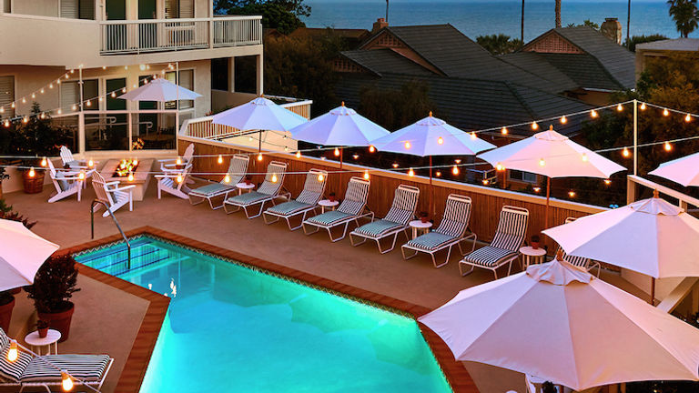 On the pool deck, guests can enjoy ocean views, a spa and a fire pit. // © 2016 Laguna Beach House