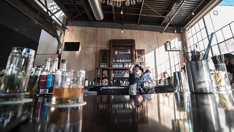 Watch the distilling process under a crystal chandelier at Tattersall Distilling. // © 2016 Sam Kovar
