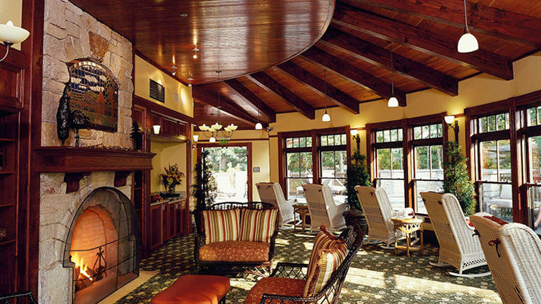 An on-property solarium includes a stone fireplace and a complimentary tea bar. // © 2016 Mohonk Mountain House/Jim Smith