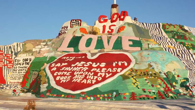 Religious or not, visitors trek out to Salvation Mountain to behold Leonard Knight’s vivid homage to love. // © 2014 Mindy Poder