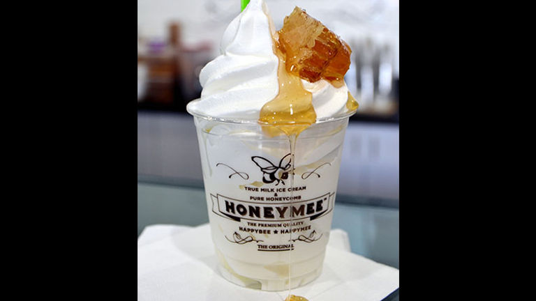 HoneyMee’s soft-serve ice cream is dressed up with natural, raw honey and honeycombs. // © 2016 Creative Commons user jpellgen