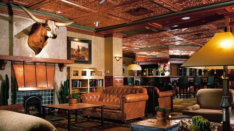 Soft leather chairs, handmade cocktails and local music attract guests to The Driskill Bar. // © 2013 Austin Convention & Visitors Bureau