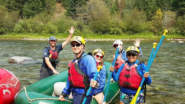 Montana Whitewater guide Ethan Greaves (left) led our group of happy rafters along the Gallatin. // © 2015 Troy Petenbrink