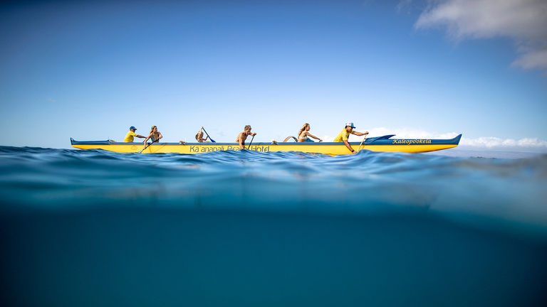 Families can socially distance on the water in an outrigger canoe.