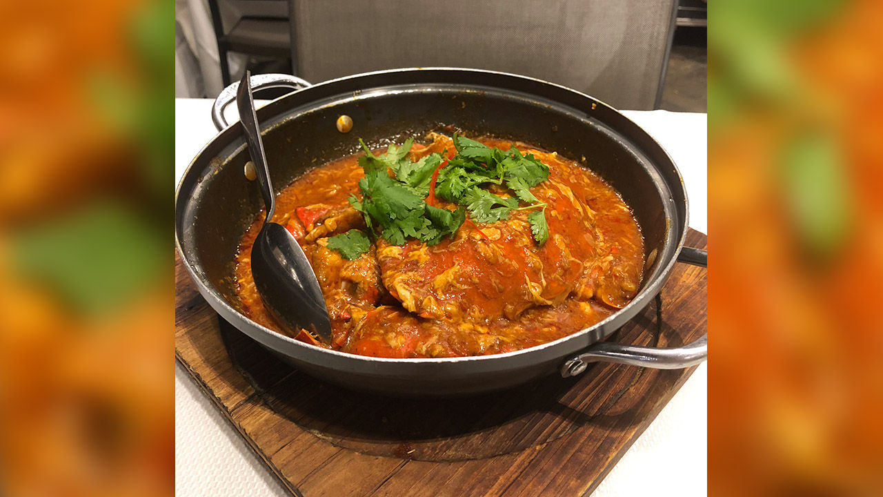 Chili crab covered in a spicy tomato-based sauce from Jumbo Seafood