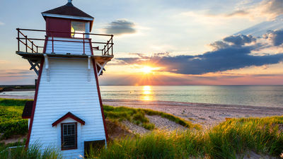 Visitors can take in the beautiful sunsets from Covehead Harbour Lighthouse on Prince Edward Island.