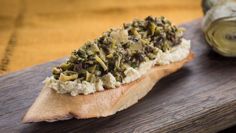 One vegetarian item is the artichoke toast with California olive tapenade.