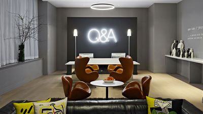 The lobby of Q&A Residential Hotel provides a preview of the guestrooms’ modern decor.
