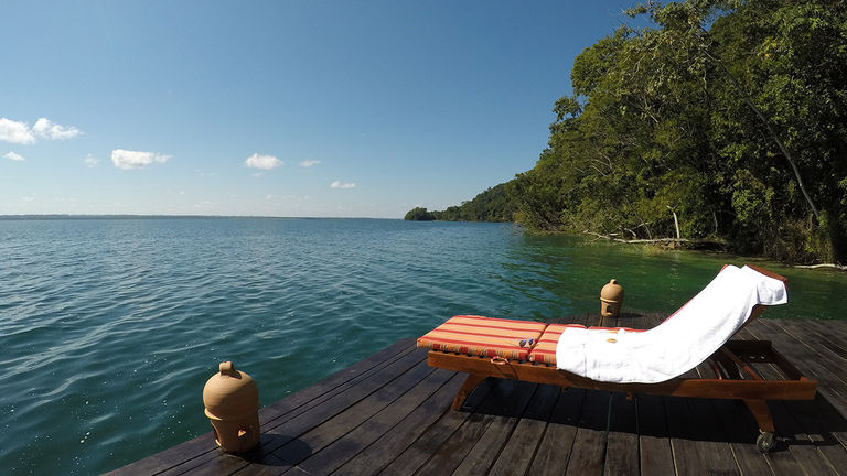 Families can swim in nearby Lake Peten Itza.