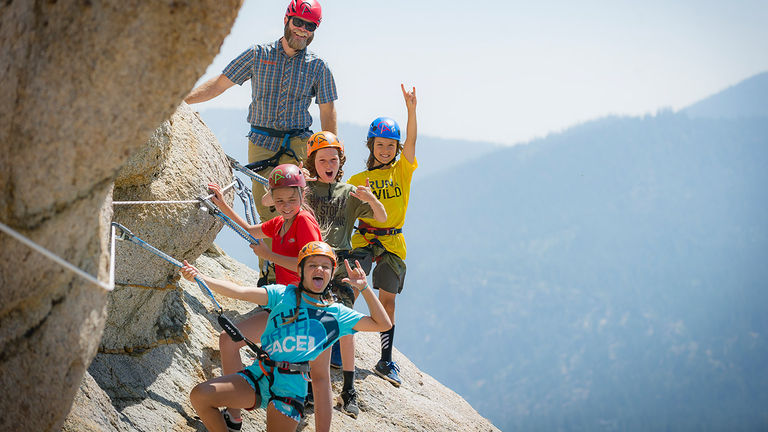 Suggest an adventure that immerses family in nature.