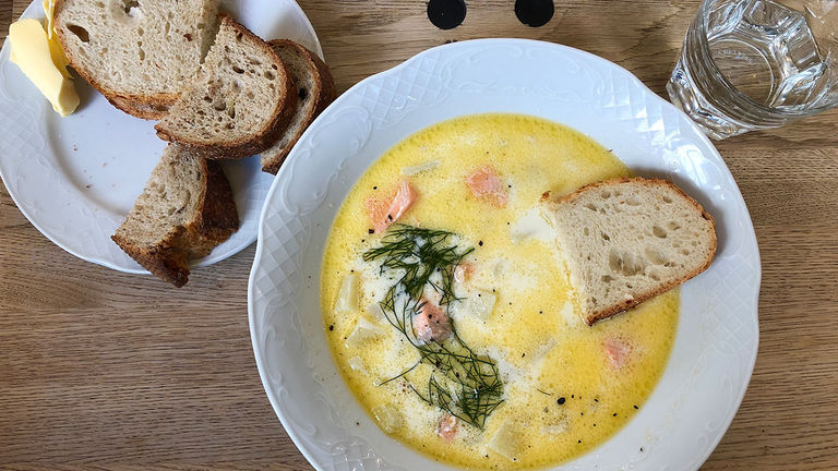 Suggest clients try lohikeitto (salmon soup) in Helsinki.