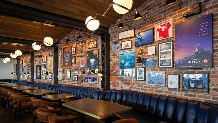 The walls of Lamplight Lounge are covered in Pixar memorabilia.