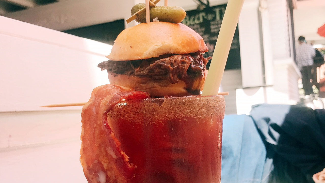 The Meaty Man (bloody mary) includes a short rib slider as a garnish.
