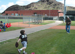 Father and son play like major leaguers at the Angel’s practice facility. // (c)  Judd Eustice